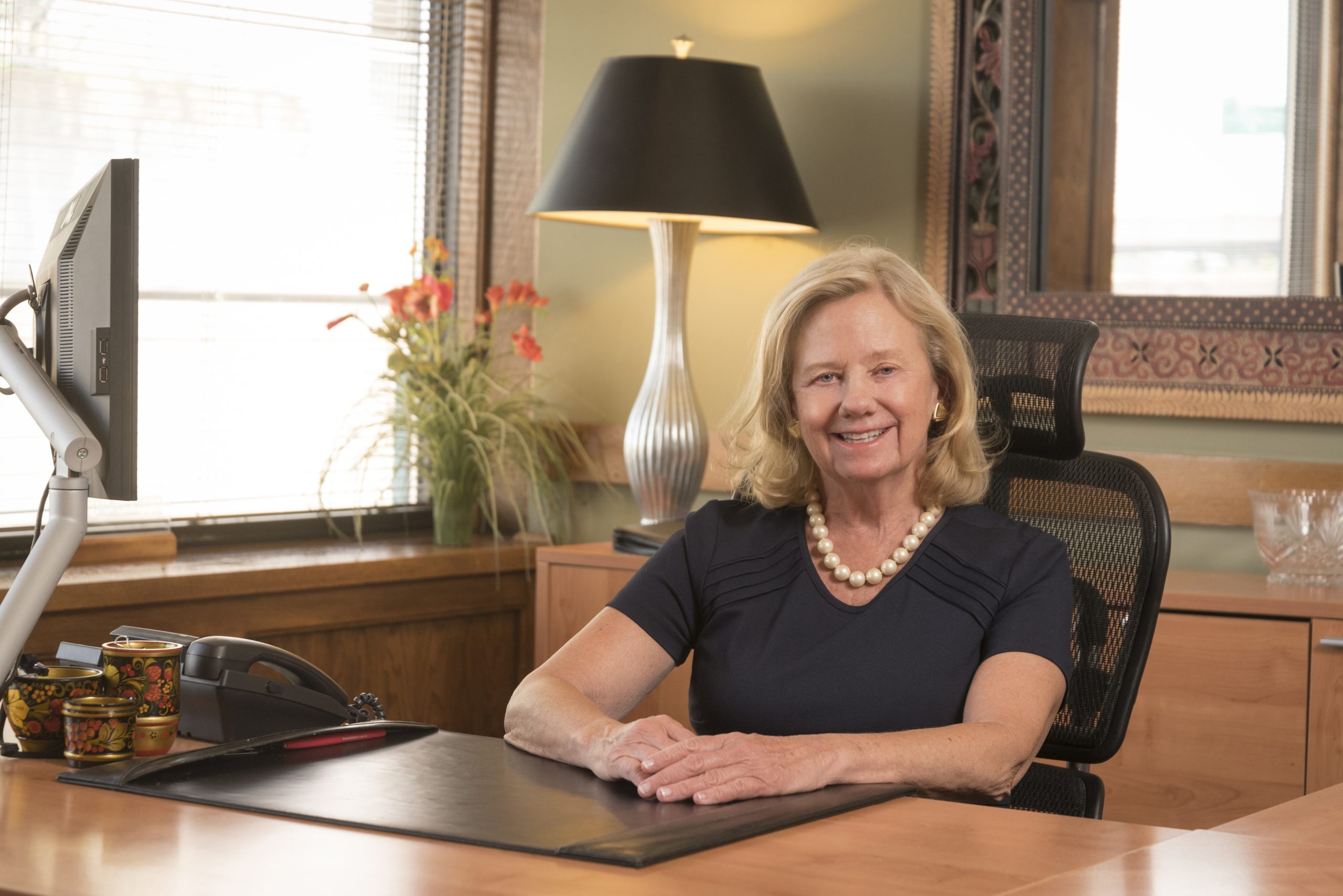 Diana sitting at her desk