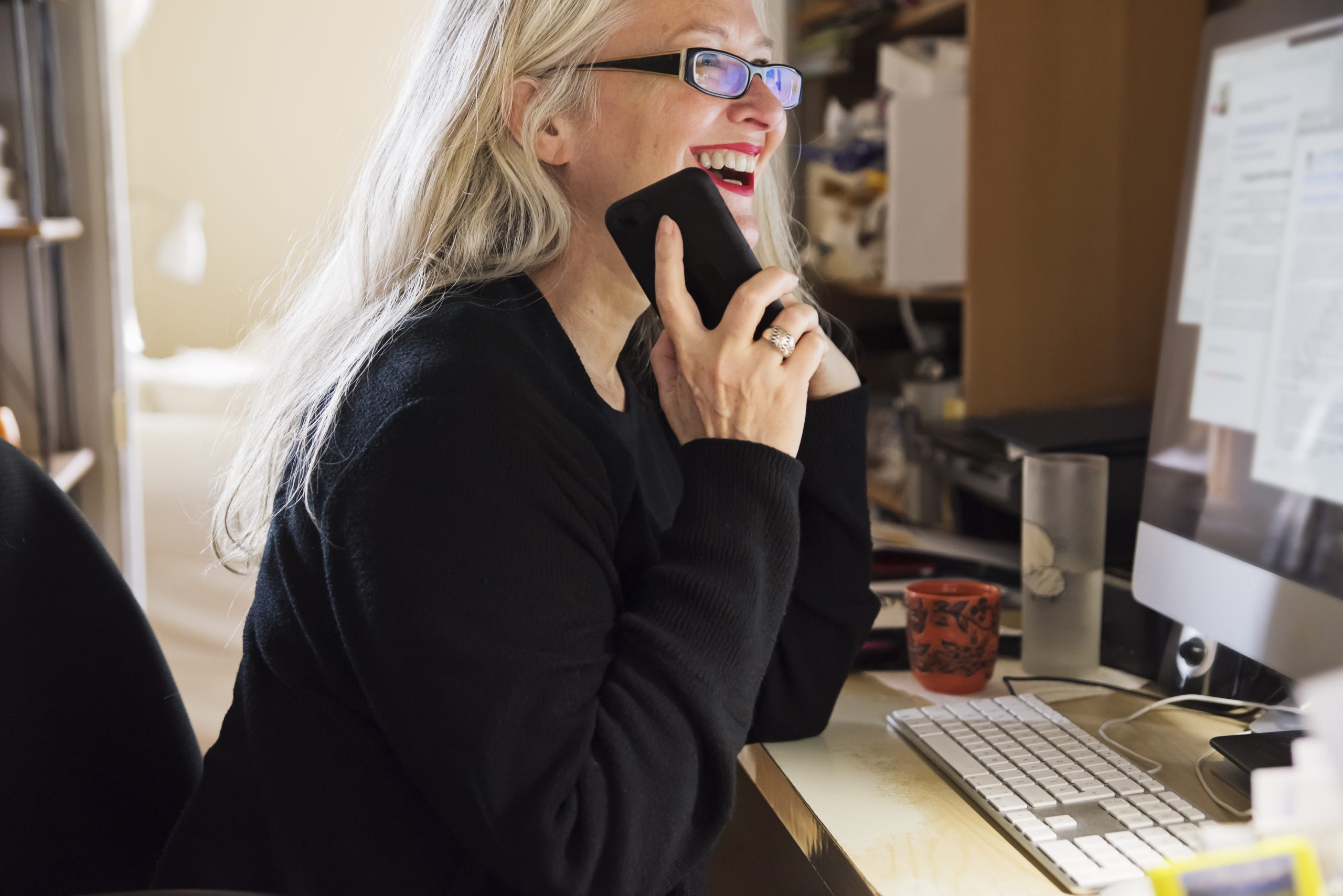 Stylish 50+ woman working from home.