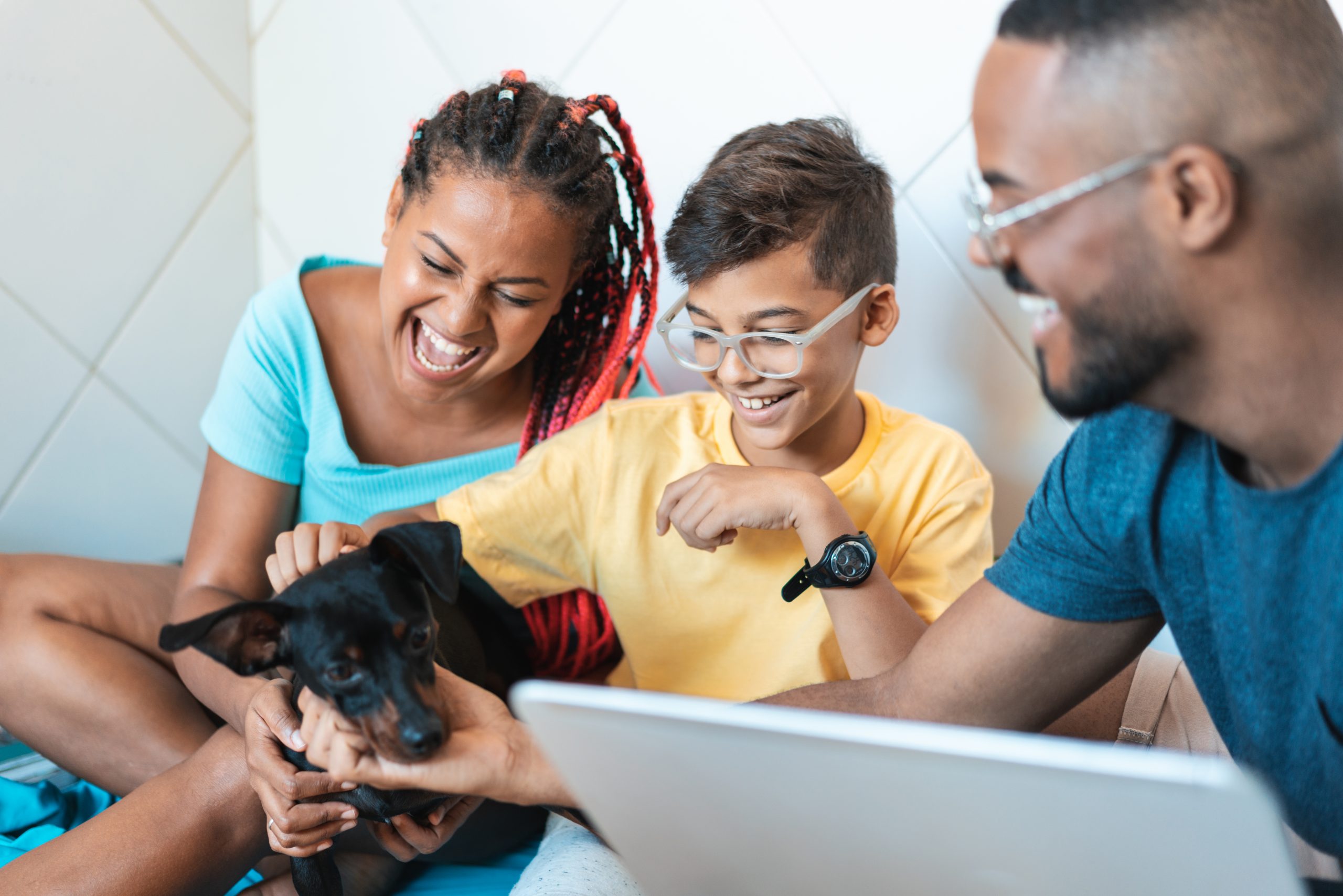 Family having fun with their pet